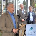 Olympic Medical Center CEO Eric Lewis, left, speaks during Saturday&rsquo;s grand opening ceremony for a new medical office building constructed by OMC in Port Angeles. In the background are OMC chief physician officer Joshua Jones and and medical physician Bill Kintner. (Keith Thorpe/Peninsula Daily News)