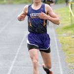 Keith Thorpe/Peninsula Daily News Murray Bingham of Sequim crossed the line to win the rain-soaked boys 1600 meter run on Friday.