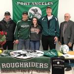 Port Angeles&rsquo; Taylar Clark with her coaches at Port Angeles High School after Clark&rsquo;s signing ceremony for Hesston College, Iowa, on Friday. From left are Jeri Boe, soccer; Rob Edwards, softball; Randy Steinman, Roughriders softball head coach; Clark; Scott Moseley, soccer; Chuck Perrizo, softball; and Kathryn Moseley, soccer.