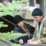 Dani Campbell and Randy Gray look over a map over the area surrounding the Sol Duc River on Wednesday as they prepare to look for Gray&rsquo;s son, Jacob Gray, an avid outdoorsman who disappeared in Olympic National Park on April 6. (Jesse Major/Peninsula Daily News)