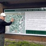Clallam County Parks Board and Port Angeles Disc Golf Association member Roger Hoffman explains the layout of the Rainshadow Disc Golf Course to Clallam County parks tour attendees Wednesday. Hoffman designed the 18-hole disc golf course northeast of Blyn, which is set to open in the early summer. (Rob Ollikainen/Peninsula Daily News)
