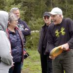 Clallam County Parks Board member Roger Hoffman, right, jokes with, from left, Allegra Pomeroy and Mary Brelsford of the Olympic Peninsula Visitor Bureau; Clallam County Parks, Fair and Facilities Director Joel Winborn; and parks board member James Whitney at the Rainshadow Disc Golf Course on Wednesday. (Rob Ollikainen/Peninsula Daily News)