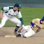 Keith Thorpe/Peninsula Daily News Port Angeles&rsquo; Colton McGuffey, left, cuts off a second base steal attempt by Sequim&rsquo;s Justin Porter in the third inning on Wednesday at Volunteer Field in Port Angeles.