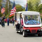 Members of the Veterans of Foreign Wars Post 91 of Tacoma march in the Brinnon Loyalty Day parade Friday. (Cydney McFarland/Peninsula Daily News)