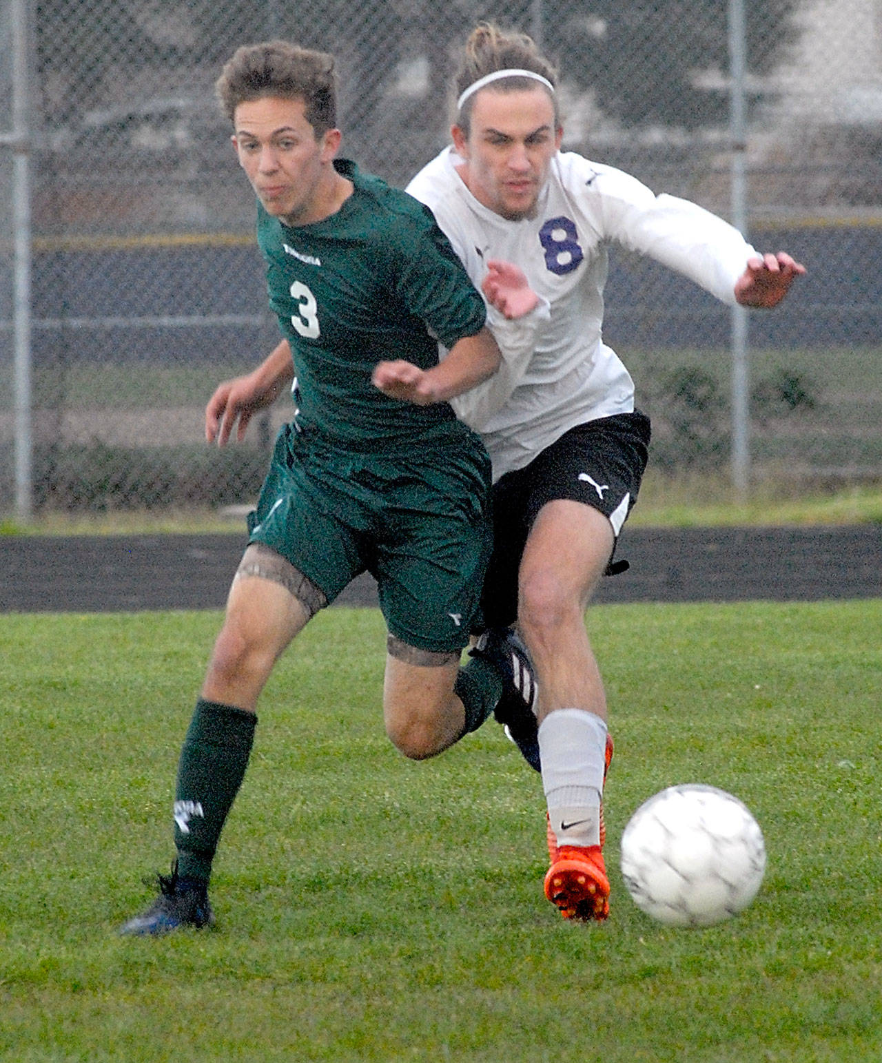 Keith Thorpe/Peninsula Daily News                                Port Angeles&rsquo; Andrew St. George, left, and Sequim&rsquo;s Liam Harris battle for control in Friday night&rsquo;s match at Sequim High School.