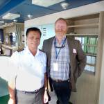 Mike Nimmo, right, the marine terminal manager, with Capt. Itoc on the bridge of New Face. (Dave Sellars/for Peninsula Daily News)