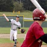 Dave Logan/for Peninsula Daily News                                Colton McGuffey for Port Angeles pitches to a Kingston batter at the start of the Roughriders game Saturday at Volunteer Park. McGuffey and Kyle Blankenship combined for a three-hitter.