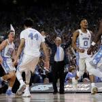 North Carolina head coach Roy Williams and players celebrate after the finals of the Final Four NCAA college basketball tournament against Gonzaga, Monday, April 3, 2017, in Glendale, Ariz. North Carolina won 71-65. (AP Photo/David J. Phillip)