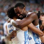 North Carolina forward Theo Pinson, right celebrates with teammate Joel Berry II, left, at the end of the championship game at the Final Four NCAA college basketball tournament, Monday, April 3, 2017, in Glendale, Ariz. North Carolina 71-65. (AP Photo/Charlie Neibergall)
