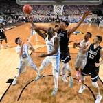 North Carolina&rsquo;s Isaiah Hicks (4) takes a shot over Gonzaga&rsquo;s Zach Collins (32) during the first half in the finals of the Final Four NCAA college basketball tournament, Monday, April 3, 2017, in Glendale, Ariz. (AP Photo/Chris Steppig, Pool)