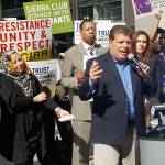 In this April 24 photo Artemio Arreola, an organizer with the Illinois Coalition for Immigrant and Refugee Rights, speaks to other advocates in downtown Chicago. The advocates plan to march in a May 1 rally in Chicago. (The Associated Press)