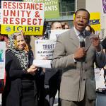 In this April 24 photo, Pastor Don Taylor of a suburban Chicago organizing group speaks to immigrant rights advocates in downtown Chicago. The advocates plan to march in a May 1 rally in Chicago. (The Associated Press)