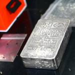 A 100-ounce bar of silver sits on the the hood of a car deputies searched Sunday after someone was reportedly driving recklessly on U.S. Highway 101 in Port Angeles. (Jesse Major/Peninsula Daily News)