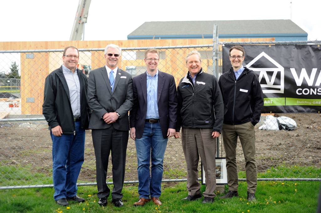 Celebrating the April 24 groundbreaking of two modular buildings using cross-laminated timber at Greywolf Elementary School are, from left, Paul Bialkowsky, Peninsula timber manager for Interfor; Sequim Schools Superintendent Gary Neal; U.S. Rep. Derek Kilmer; state Rep. Steve Tharinger; and Joseph Mayo, an architect with Mahlum Architects of Seattle. (Michael Dashiell/Olympic Peninsula News Group)