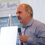 Steve Burke, executive director of William Shore Memorial Pool in Port Angeles, tells those who attended Wednesday&rsquo;s Port Angeles Regional Chamber of Commerce luncheon of the planned expansion for the pool. (Jesse Major/Peninsula Daily News)