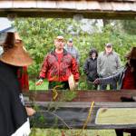 As Vince Penn sings, tribal members bless a canoe before it&rsquo;s removed from Pioneer Memorial Park in Sequim on April 8. (Michael Dashiell/Olympic Peninsula News Group)