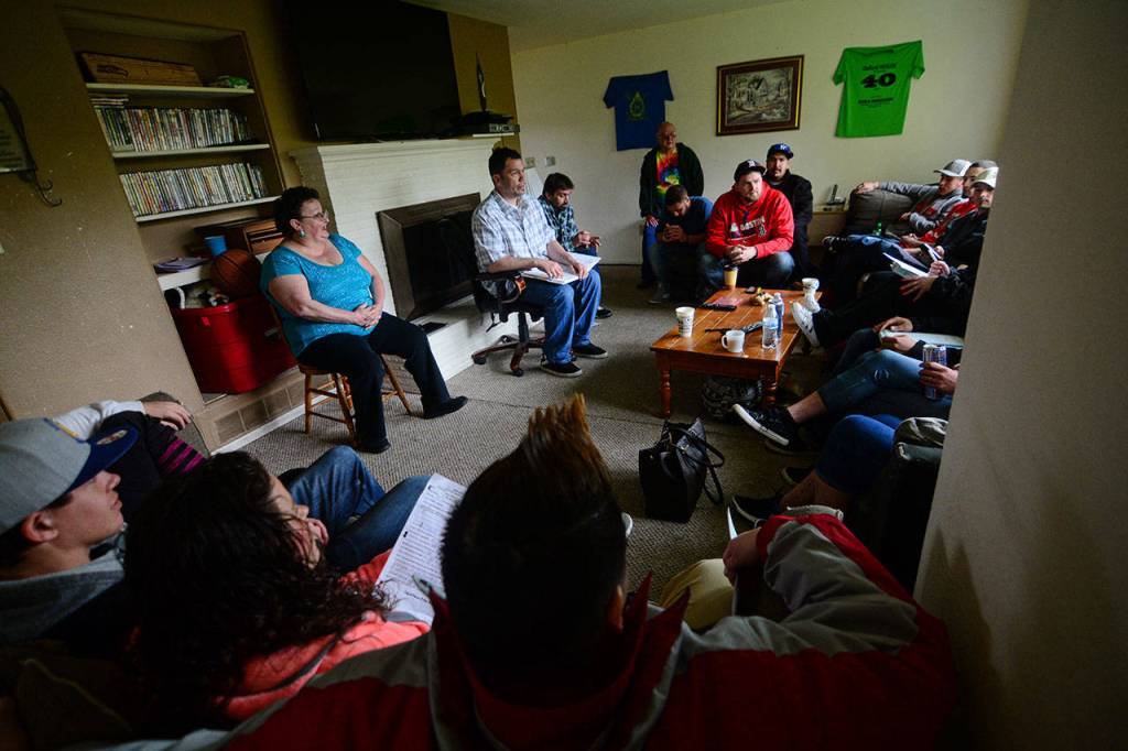 Oxford House residents in Port Angeles during their monthly chapter meeting. (Jesse Major/Peninsula Daily News)
