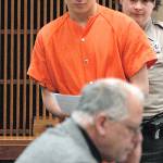 Benjamin Bonner approaches defense attorney Harry Gasnick during Bonner&rsquo;s first appearance in Clallam County Superior Court on Friday on charges of second-degree murder, animal cruelty and theft of a motor vehicle. (Keith Thorpe/Peninsula Daily News)
