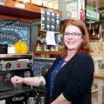 Marla Overman gets reacquainted with her coffee skills by steaming a pitcher of milk at the Boiler Room in Port Townsend. Overman got her start there as a barista and now serves on the board of directors. (Steve Mullensky/for Peninsula Daily News)