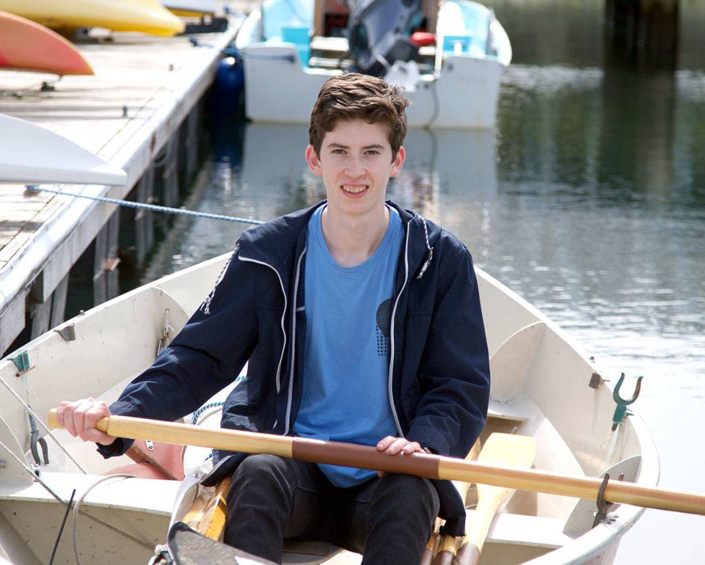 Milo Rolland, 2017 Heart of Service Award winner, in his 14-foot sailing dory at Point Hudson Marina. (Steve Mullensky/for Peninsula Daily News)