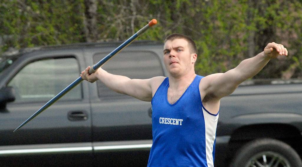 Keith Thorpe/Peninsula Daily News                                Crescent&rsquo;s Neil Peppard throws the javelin on Friday on his home track in Joyce.