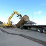 An old tank at the Port Angeles Boat Haven is loaded onto a trailer for disposal. (David G. Sellars/for Peninsula Daily News)
