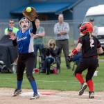 Steve Mullensky/for Peninsula Daily News                                Grace Yaley has the ball and the out at first on Coupeville&rsquo;s Sarah Wright in the Cowboys&rsquo; Olympic League 1A Division-clinching win over the Wolves.