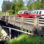 Traffic crosses the McDonald Creek bridge on Old Olympic Highway near Agnew on Tuesday. (Keith Thorpe/Peninsula Daily News)