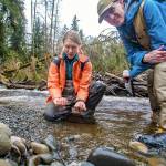 Nature Conservancy aquatics ecologist Emily Howe and forest ecologist Ryan Haugo explore the Hoh River. (Joel Rogers)