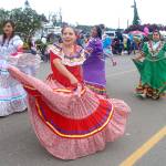 Dancers from the Mexican Community of Sequim parade entry create a swirl on color Saturday. (Keith Thorpe/Peninsula Daily News)
