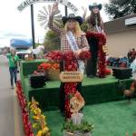 Clallam County Fair Princess Marykate Napiontek, left, and Queen Janeydean O&rsquo;Connor wave to Irrigation Festival Grand Parade spectators Saturday. (Keith Thorpe/Peninsula Daily News)