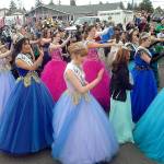 Royalty from a variety of Western Washington festivals gather to dance the &ldquo;Macarena&rdquo; before the start of Saturday&rsquo;s Irrigation Festival Grand Parade. (Keith Thorpe/Peninsula Daily News)