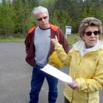 Ron and Barbara Carr, residents of the O&rsquo;Brien Meadows development in the Little Oklahoma area near the foothills southeast of Port Angeles, point out property near their home that might not be governed by land-use rules that the rest of their neighborhood must adhere to. (Keith Thorpe/Peninsula Daily News)
