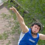 Keith Thorpe/Peninsula Daily News Wyatt McNeece of Crescent throws in Thursday&rsquo;s shot put competition on his home field in Joyce.