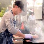 Arran Stark, the executive chef at Jefferson Healthcare hospital, demonstrates how to prepare a salmon dish at Saturday&rsquo;s farmers market as part of the Port Townsend Artisan Food Festival. (Cydney McFarland/Peninsula Daily News)