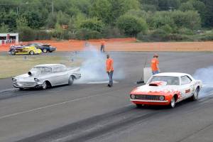Dave Edwards of Port Angeles, left, and Vic Whitehead of Forks burn rubber to the starting line during a West End Thunder race last season. (Lonnie Archibald/for Peninsula Daily News)