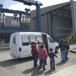 A tour group exits a shuttle bus at Westport Yachts after completing a tour of the Port of Port Angeles marine terminals during Waterfront Day last year. (Peninsula Daily News)