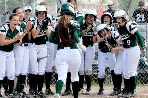 DISTRICT SOFTBALL: Rider girls muscle up
