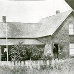 The home of Capt. Samuel and Mary Clements is shown in Brinnon with the Clements standing on the front steps. (Jefferson County Historical Society)