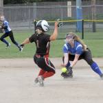 Lonnie Archibald/Peninsula Daily News Chimacum&rsquo;s Shaniya Nisbet tags out Seattle Christian&rsquo;s s #21 tags Seattle Christian&rsquo;s Kelli Ronish during an attempted steal in the Cowboys&rsquo; 9-8 win Friday.