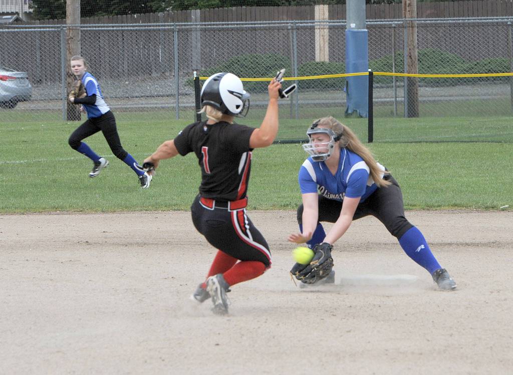Lonnie Archibald/Peninsula Daily News Chimacum&rsquo;s Shaniya Nisbet tags out Seattle Christian&rsquo;s s #21 tags Seattle Christian&rsquo;s Kelli Ronish during an attempted steal in the Cowboys&rsquo; 9-8 win Friday.