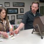 Clallam County Auditor Shoona Riggs, left, arranges slips of paper containing the names of candidates as county elections supervisor Rick Wagner pulls slips from a tumbler to determine the order names will appear on the ballot during Friday&rsquo;s drawing at the Clallam County Courthouse in Port Angeles. (Keith Thorpe/Peninsula Daily News)