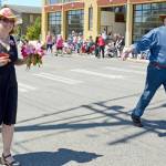 Jefferson County Commissioners Kate Dean and David Sullivan wave and hand out candy during the Rhody Festival Grand Parade in Port Townsend on Saturday. (Cydney McFarland/Peninsula Daily News)