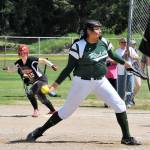 Lonnie Archibald/for Peninsula Daily News Port Angeles&rsquo; Nizhoni Wheeler delivers a pitch in the Roughriders&rsquo; West Central District 3 semifinal 16-0 win over Orting. The Riders went on to beat White River 13-2 in the district championship game later in the day.