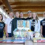 Chimacum High School students Cora Willis, Lacey Bishop, Kyle Tenny, Mason Lawson, Zachery Engle, Seth Richey and We Act Club adviser Piper Diehl, from left, were honored for their Food4All donation box. (Cydney McFarland/Peninsula Daily News)