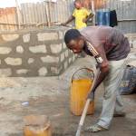An unidentified man works on a &ldquo;dignity toilet&rdquo; in a village in Togo, a country in West Africa.