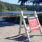 Anderson Lake near Chimacum is closed again due to toxins. The lake is closed to swimming, fishing and boating, though the state park remains open to hikers. (Cydney McFarland/Peninsula Daily News)