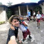 Jefferson Community School student Rowan takes a selfie with some kids at a school in Soroa, Cuba. (Jefferson Community School)