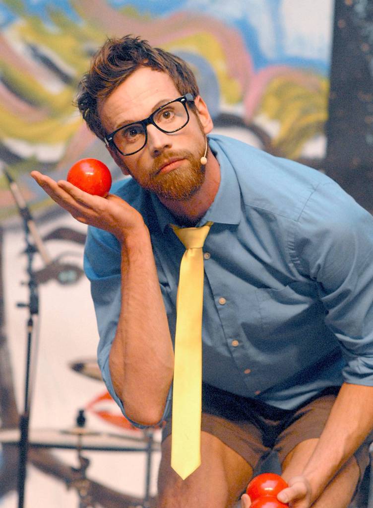 Ty Vennewitz, who performs under the stage name of Cirque Love Love, hams it up with a juggling ball during his performance Saturday on the Main Stage of the Vern Burton Community Center. (Keith Thorpe/Peninsula Daily News)