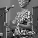 Keith Thorpe/Peninsula Daily News                                Shei Mawa of the world music group Global Heat dances during their Saturday set on the Juan de Fuca Main Stage.